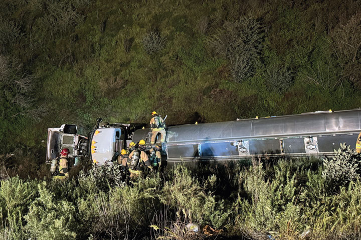 SBC Firefighters are preparing to drill into each fuel tank section with specialized equipment in order to transfer the fuel into a waiting tanker truck.