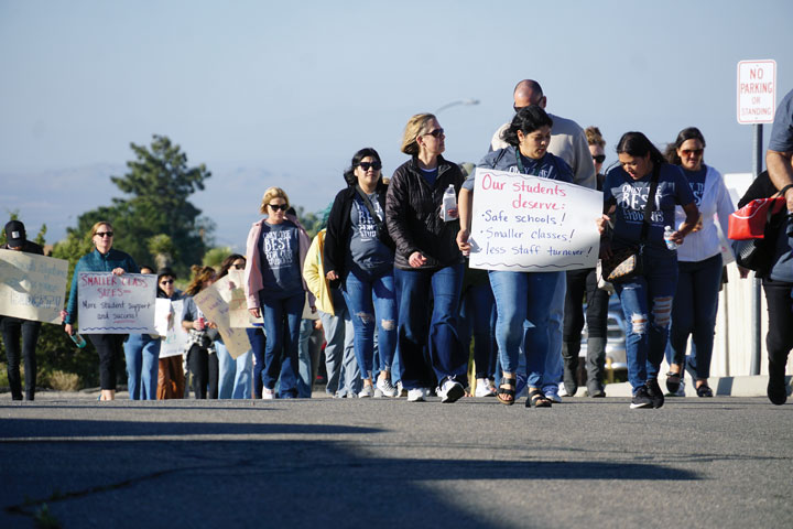 Walking around the block at the "Board-walk," Snowline employees show unity in their push for fair compensation and benefits.