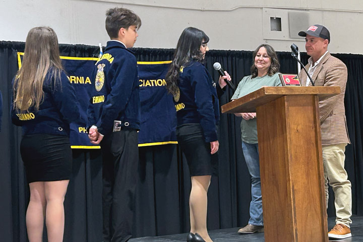 A high honor, Rhiannon Westerkamp and Davy Feller are inducted as Honorary Members of the Serrano FFA.