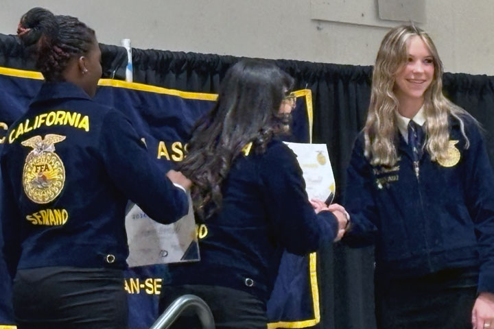 Gracie MacDonald is pictured accepting her award at the Serrano FFA Banquet.