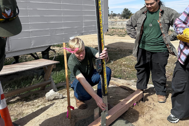 Gavin works on getting the foundation for the structure just right.