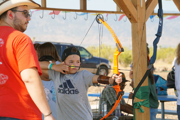 This young archer is laser-focused on the bullseye.