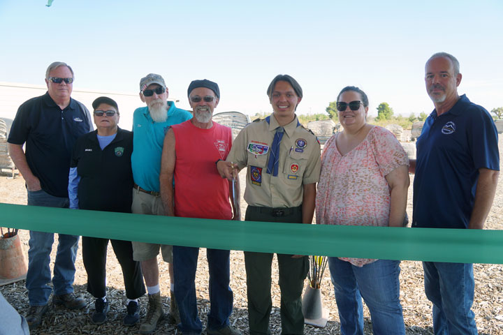The official ribbon cutting at the Mojave Archers Archery Range in Phelan, hosted by the Phelan Pinon Hills Community Services District.  Pictured are Steve Lowrance - Parks and Rec Mgr., Mojave Archers Mabel Ison, Don Ison, and George Du Bois, Eagle Scout Richard Stephen, PPHCSD Director Deborah Philips, and PPHCSD General Manager Don Bartz.