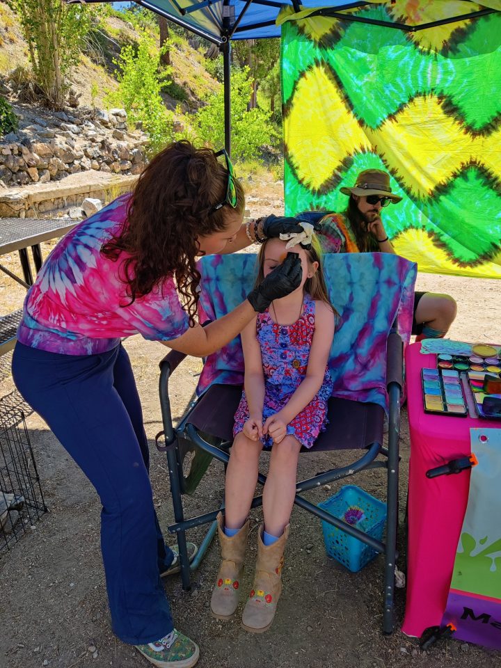 Kids waited excitedly for their turn to get their face painted! Face Paint provided by: I DYED