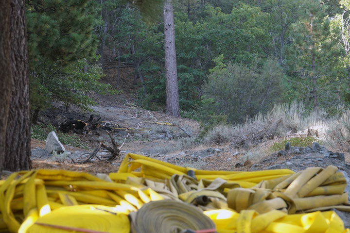 Hose line in preparation for fire fighting and line containment