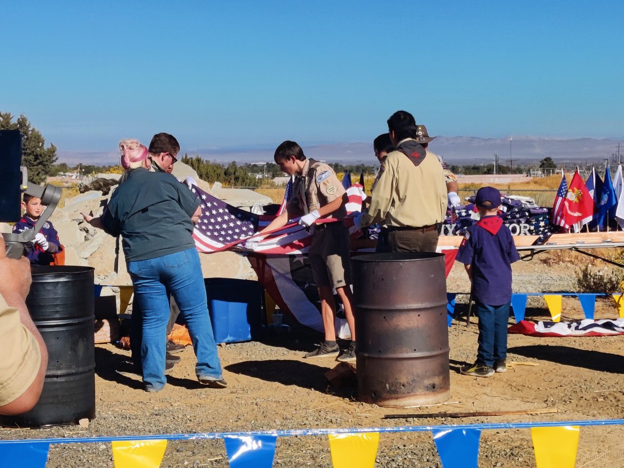 They begin to separate the stripes from the stars as it is being respectfully taken out of service.