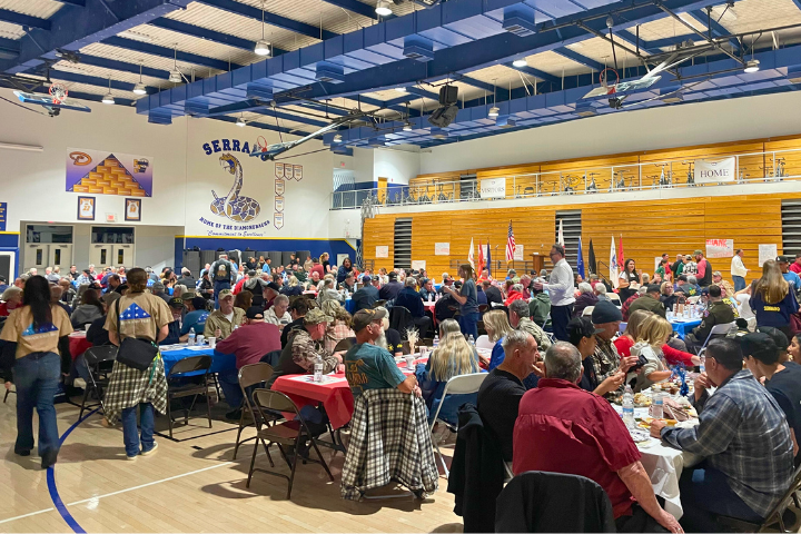 A packed gym shows how the annual Veterans Dinner event has grown significantly in the past 30 years.