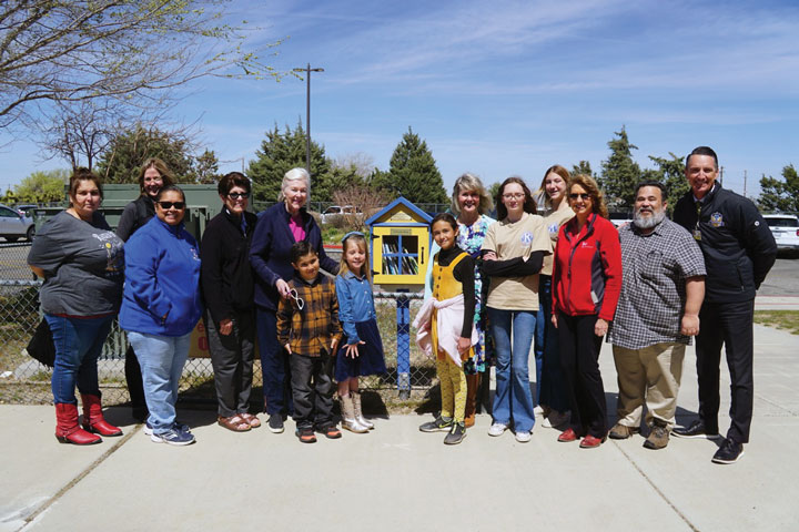 March: Kiwanis dedicated a Little Community Library at Heritage School honoring founding Kiwanis member              Karen Frazer (pictured).  Many Kiwanians, Snowline staff and students were in attendance for the event.