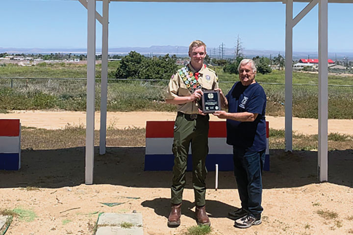 May: VFW Post 9415 Commander Mike Bazylak presented a commemorative plaque to Eagle Scout                                                                        Gavin Michael McClean for his Eagle Scout Project of providing shade covering for the VFP Post's horseshoe grounds.
