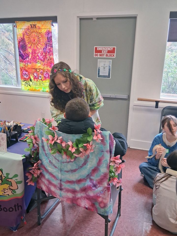 I Dyed Face Painting is hard at work during the Wrightwood Earth Day Event.