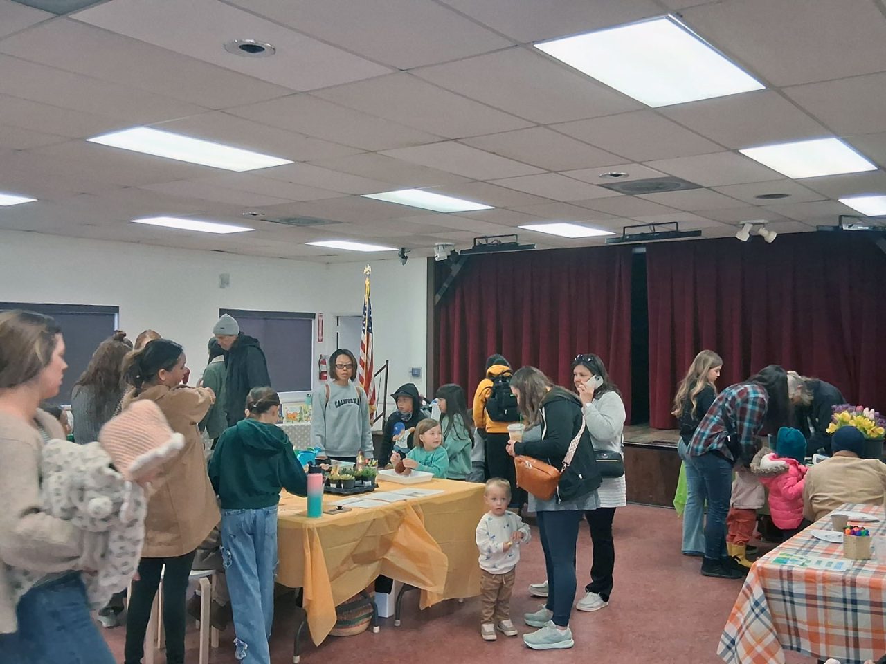 A room full of parents and kids learning about Mother Nature and spending some quality time together.
