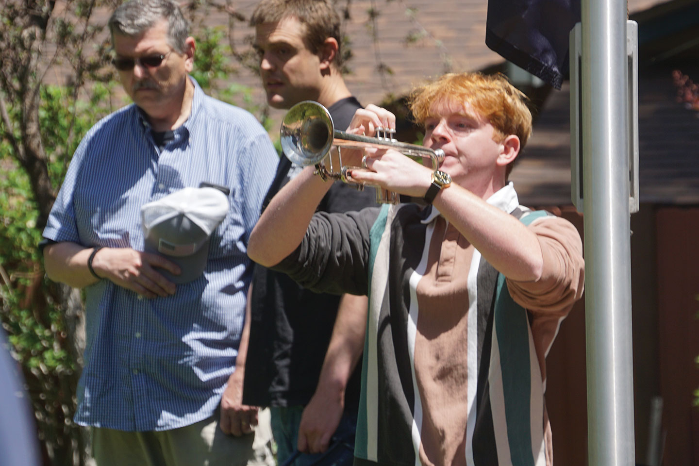 Chris Johnson performs “Taps” at the close of the Memorial Day ceremony in Wrightwood. The solemn bugle call marked the final tribute to fallen service members, as the crowd stood in silence.
