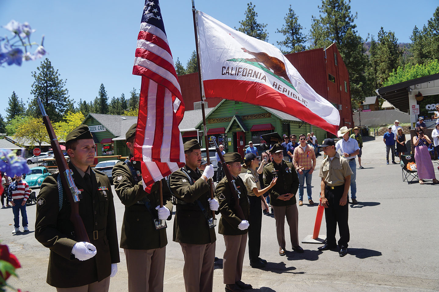 The Fort Irwin Color Guard presented the American and California flags during the start of the ceremony, while onlookers stood at attention along Evergreen Road in Wrightwood.