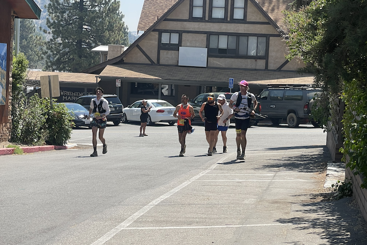 AC100 runners make their way to the Wrightwood Community Parking Lot to cross the finish line. (Photo by Samuel Prince)