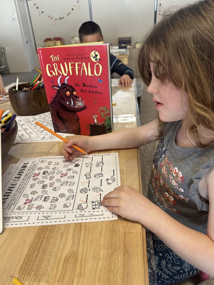 Students working on a search and find page related to The Gruffalo story they read in class.