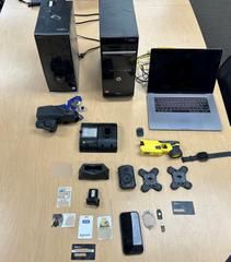 Law Enforcement items recovered during the search of a home located in the 600 block of Bewley Street in Santa Ana.