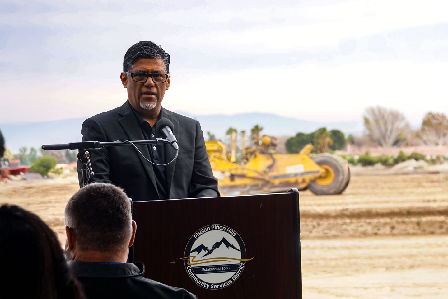Heavy equipment sits behind Engineering Manager George Cardenas during the Feb. 10 groundbreaking ceremony at the future site of the PPHCSD Civic Center and Emergency Operations Center.