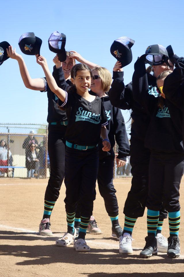 The Lights Out Softball players are ready to start the season at last year's opening day.