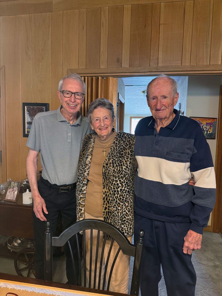 Lora Steinmann, center, is joined by her two brothers during a surprise celebration at her Wrightwood home ahead of her 90th birthday.