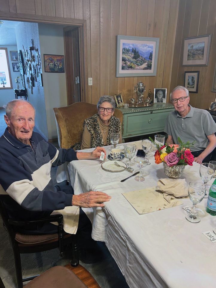 Lora Steinmann, center, is joined by her two brothers during a surprise celebration at her Wrightwood home ahead of her 90th birthday.