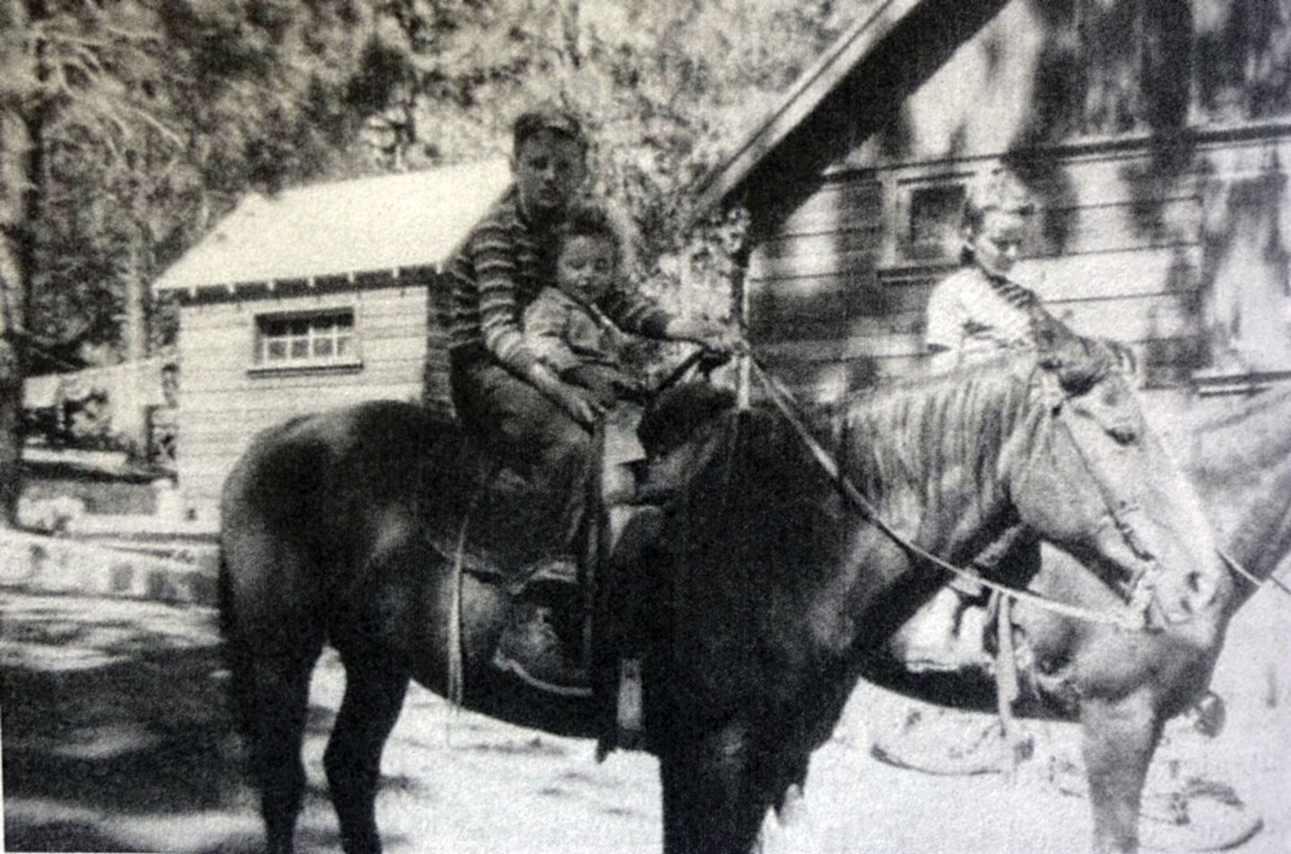 A young Lora Steinmann, right, and her brothers pose on horseback in Wrightwood in 1947, capturing an early chapter of a life deeply rooted in the community.