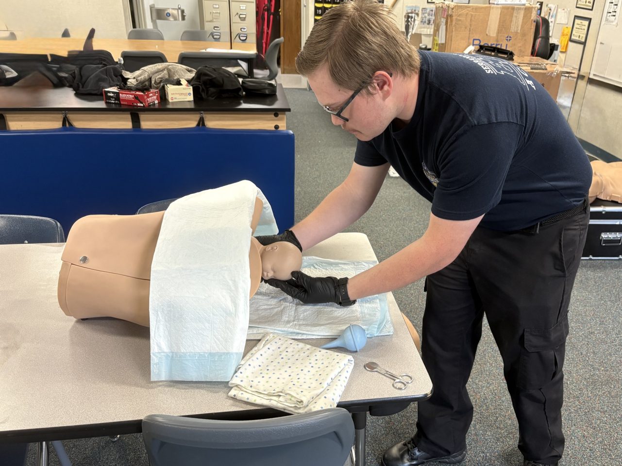 Here, an EMT student uses "Birtha", another piece of equipment practiced with daily.