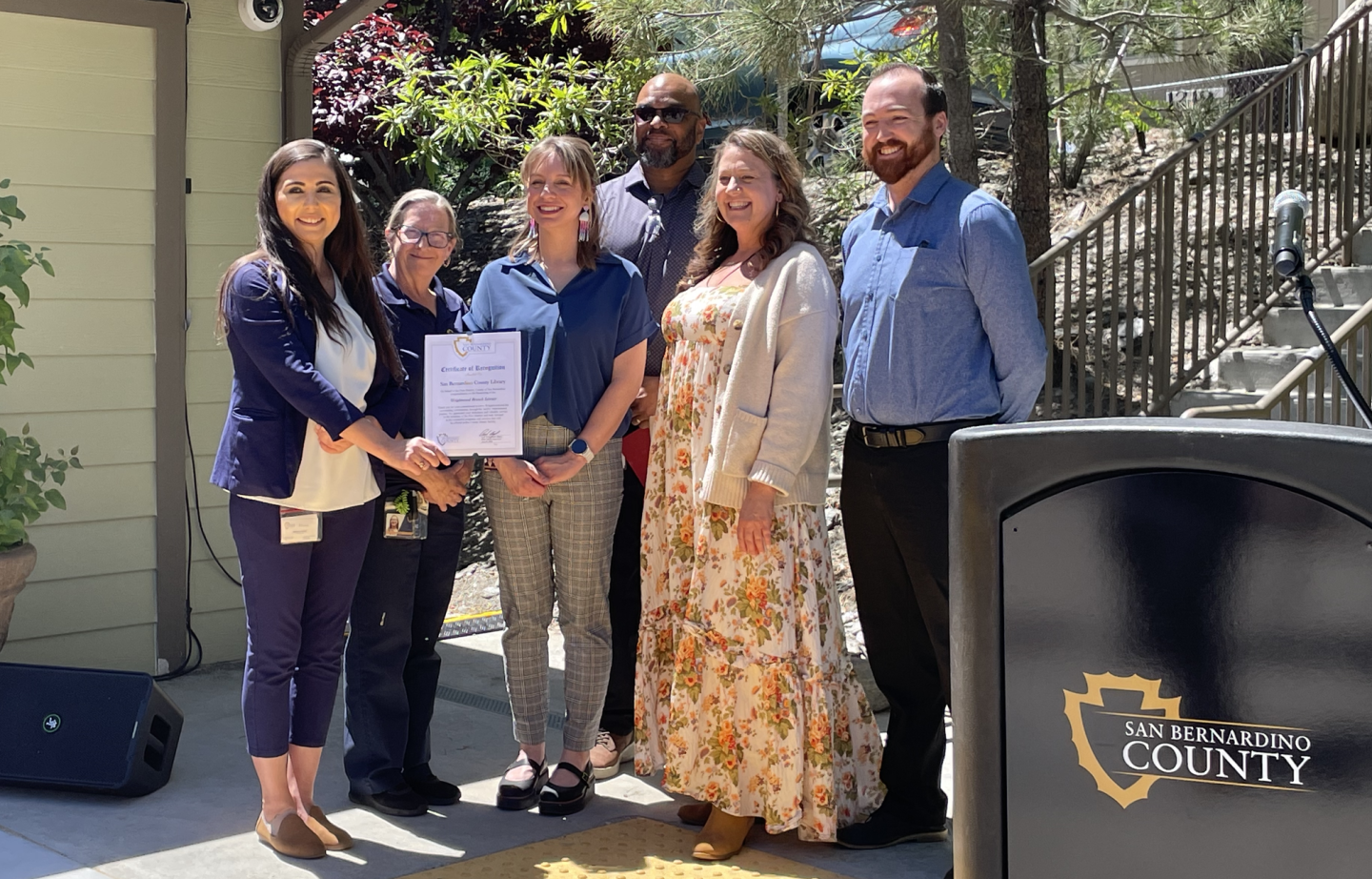 Supervisor Paul Cook's office sent a representative to present the library staff with a certificate of recognition.