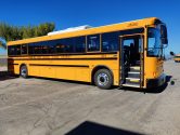 One of the many Snowline Transportation buses out on the road daily, transporting precious cargo to and from school. Photo credit: Deseree Audette