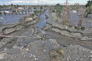 the corner of La Mesa and Colorado: Water main line damage, water service line damage and other utility line exposure and possible damage, possibly electricity, cable, fiber or all of them and more.  Note: the pickup truck in the upper right corner up to the fenders in mud.  Erosion at least 6 feet deep and heading north down Colorado towards El Mirage. Photo credit: George Cardenas - PPHCSD